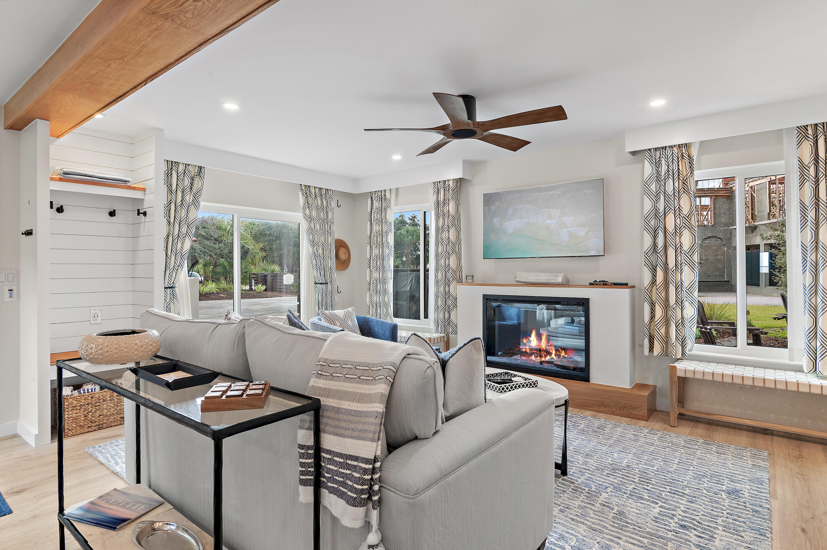 255 Blue Mountain Road, Unit 8 Santa Rosa Beach, FL 32459 - Photo 4 of 53 a living room with furniture a fireplace and a large window