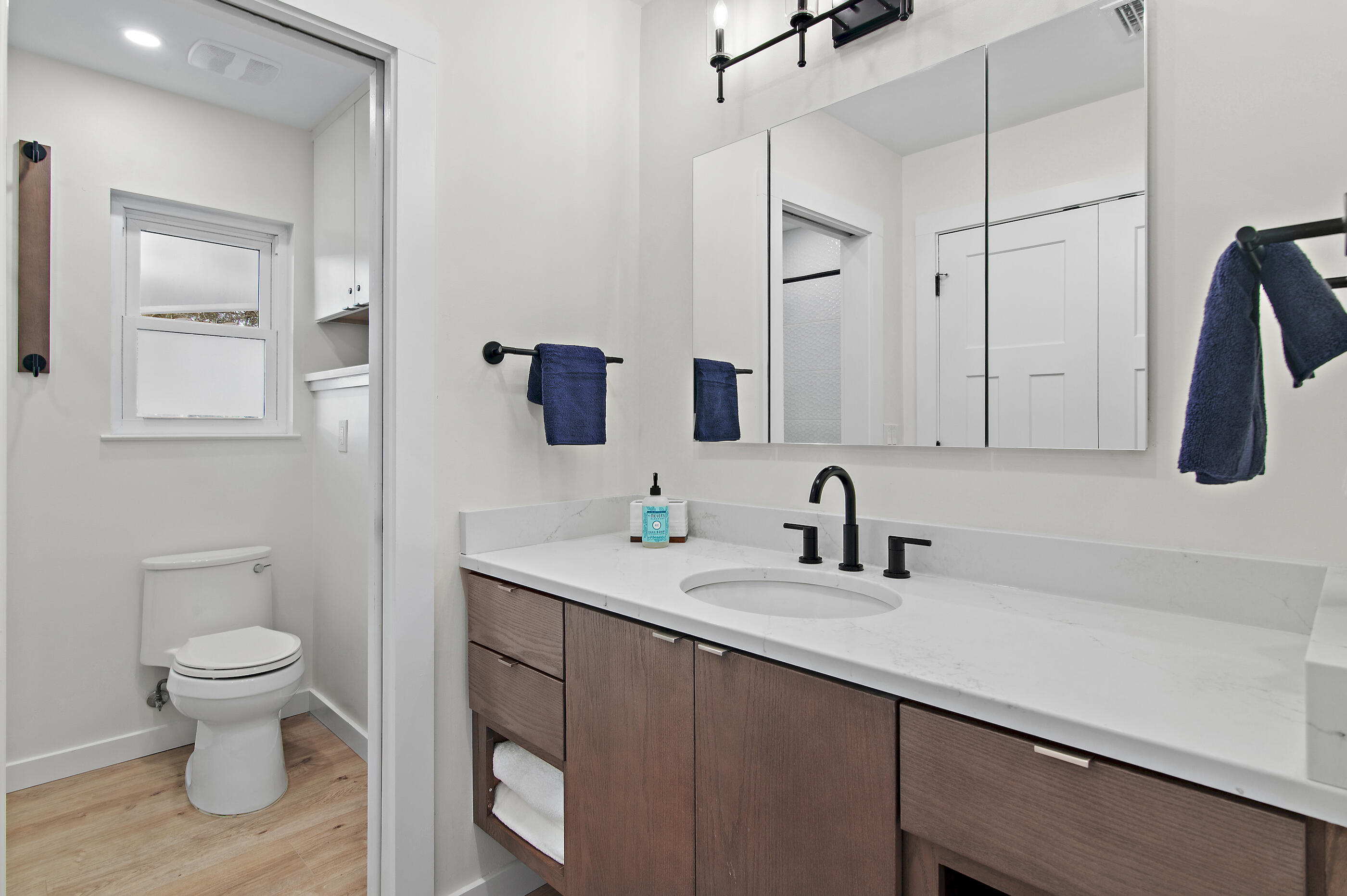 255 Blue Mountain Road, Unit 8 Santa Rosa Beach, FL 32459 - Photo 41 of 53 a bathroom with a toilet sink and mirror
