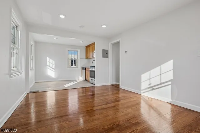a view of a kitchen with a sink and a window