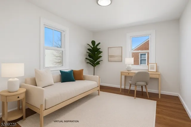 a living room with furniture a table and chair