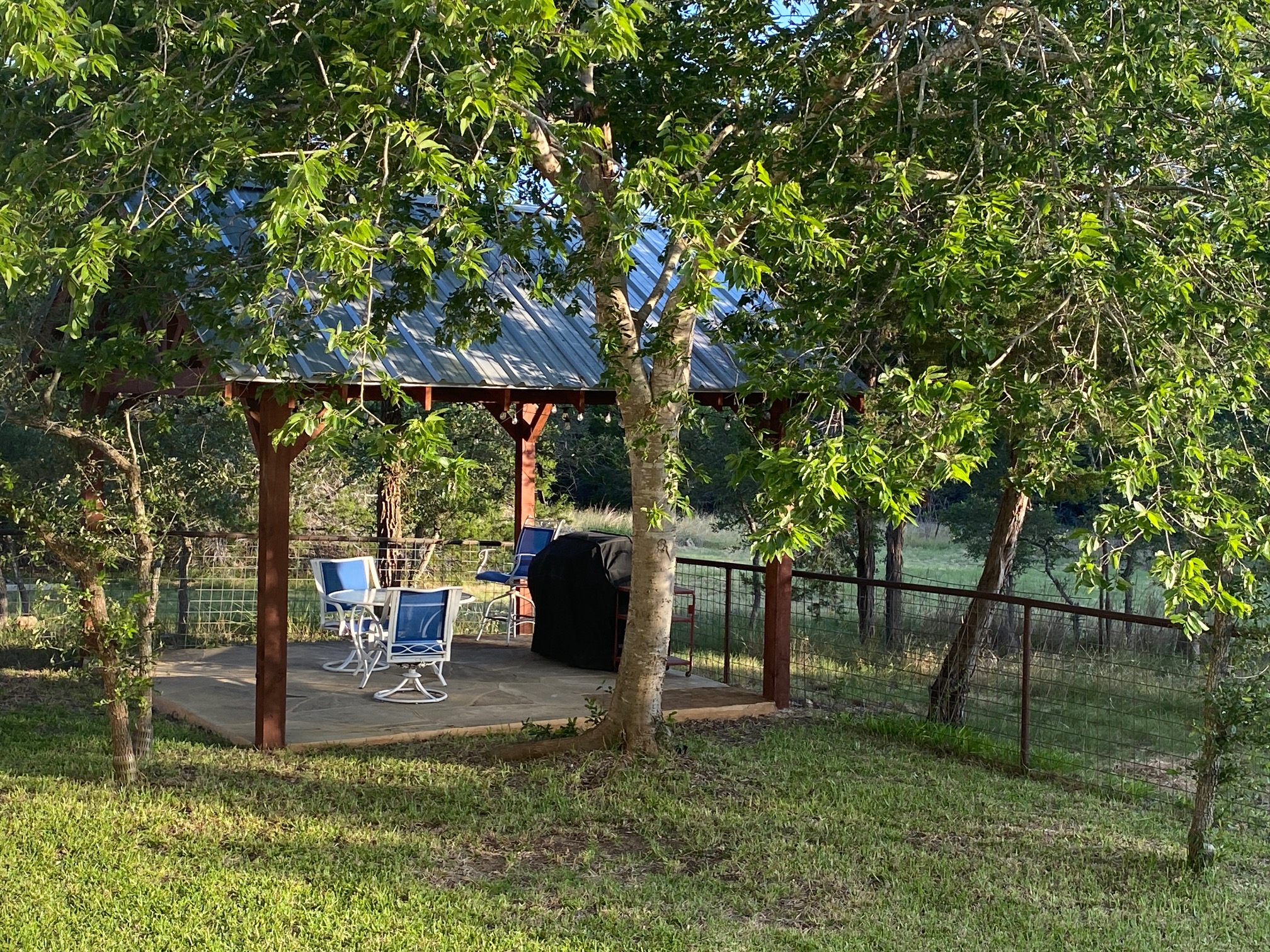 306 Plainview Road Wimberley, TX 78676 - Photo 22 of 29 An inviting shaded outdoor space, perfect for relaxation.