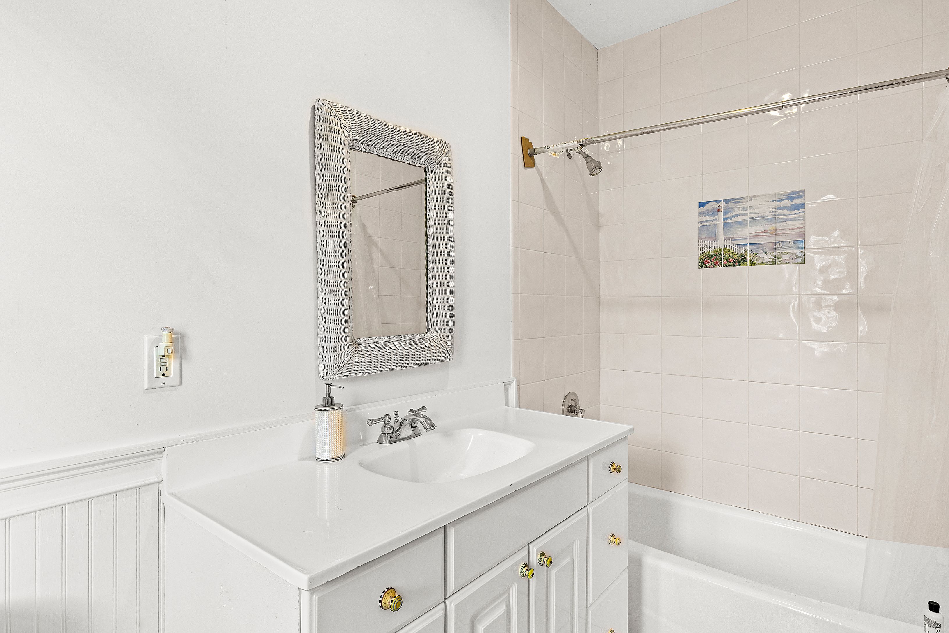 4 Bayberry Road Montauk, NY 11954 - Photo 12 of 29 a bathroom with a sink and a mirror