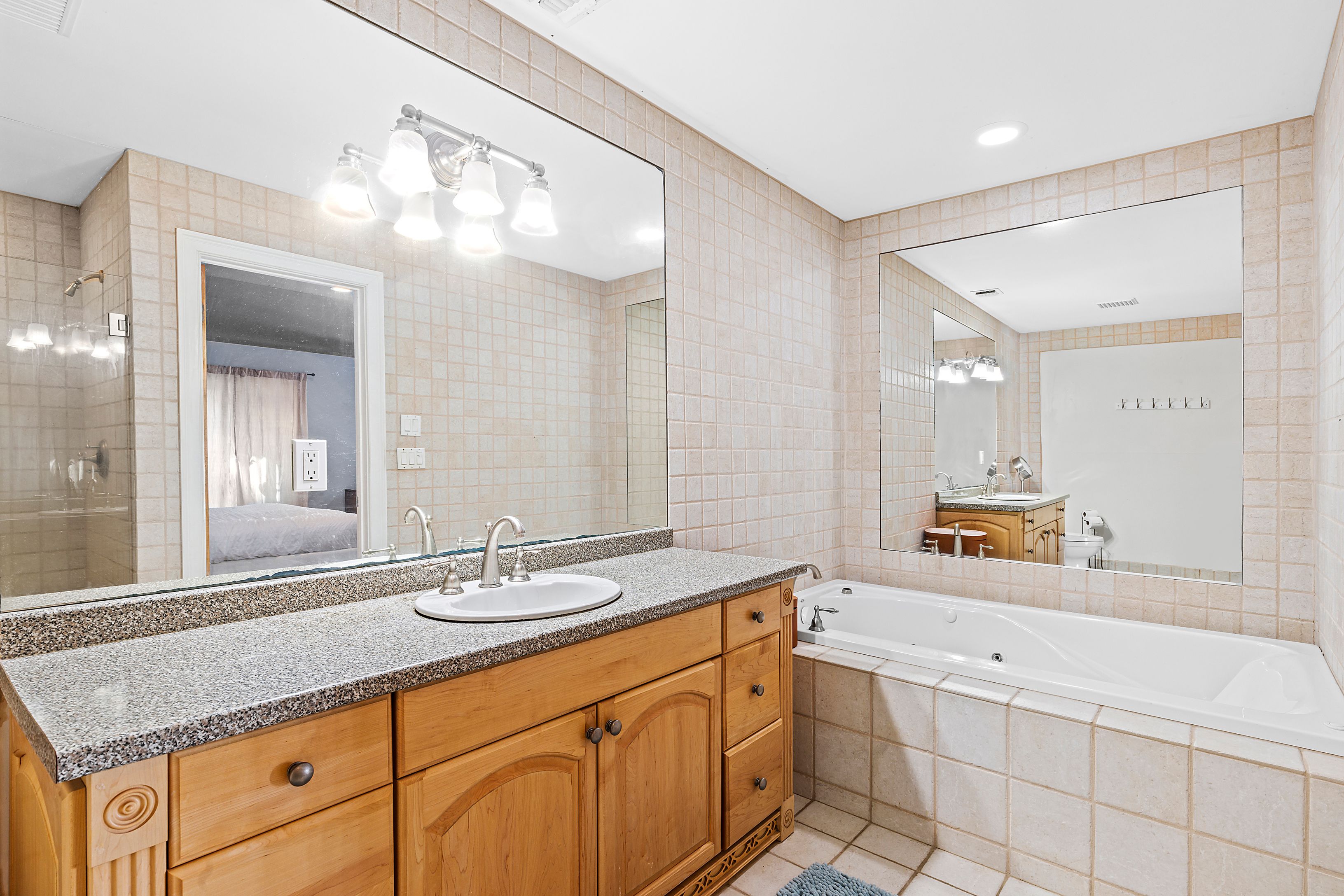 4 Bayberry Road Montauk, NY 11954 - Photo 14 of 29 a bathroom with a granite countertop sink mirror and double