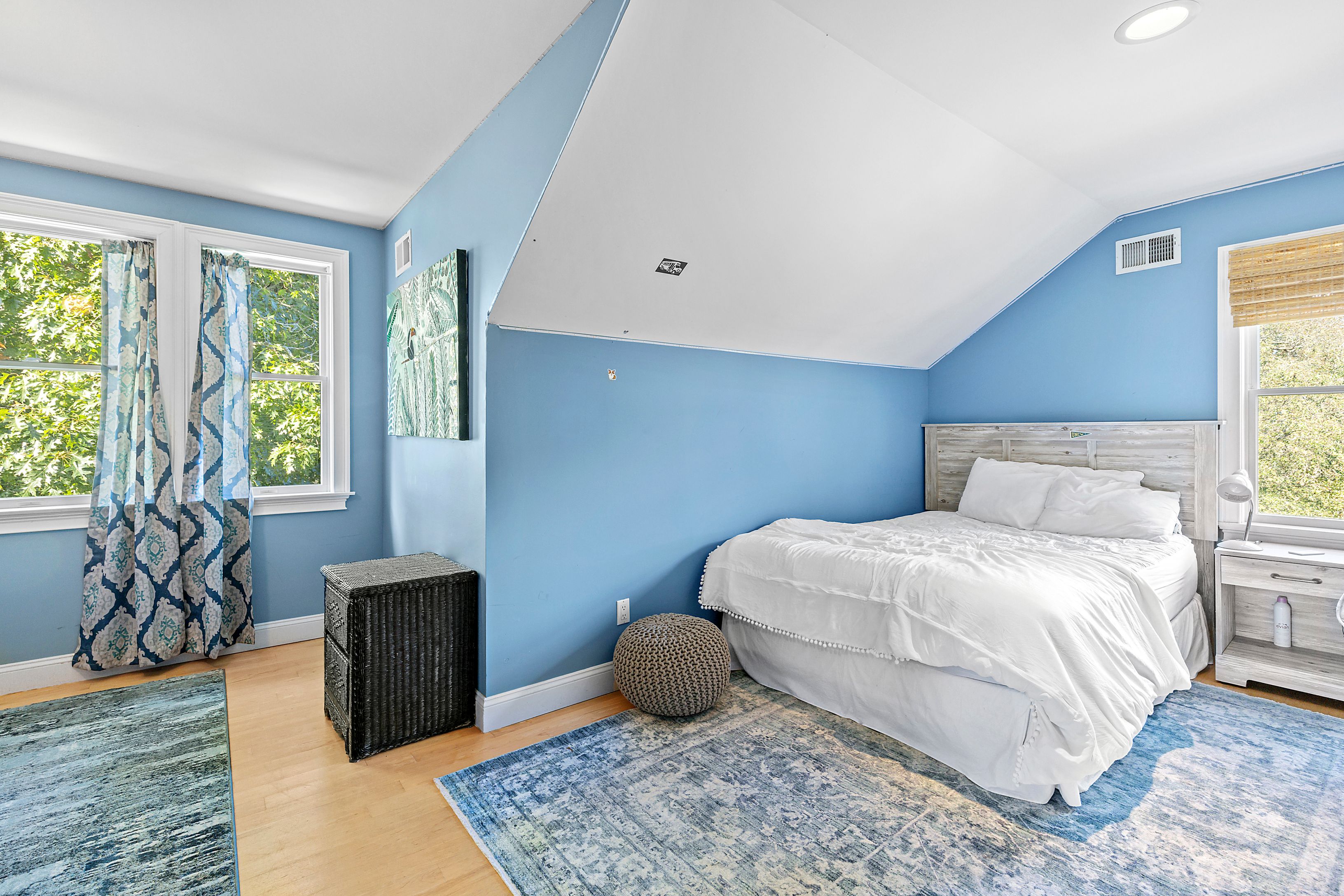 4 Bayberry Road Montauk, NY 11954 - Photo 20 of 29 a bedroom with a bed and wooden floor