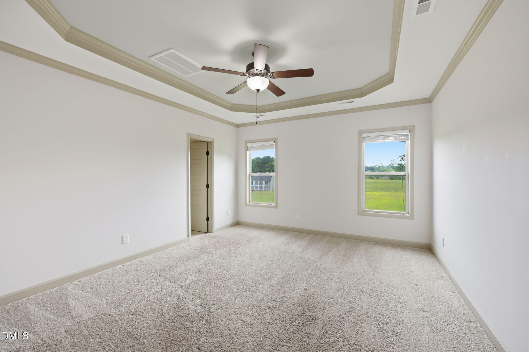 3587 Hannah Creek Road Benson, NC 27504 - Photo 17 of 43 an empty room with windows and fan