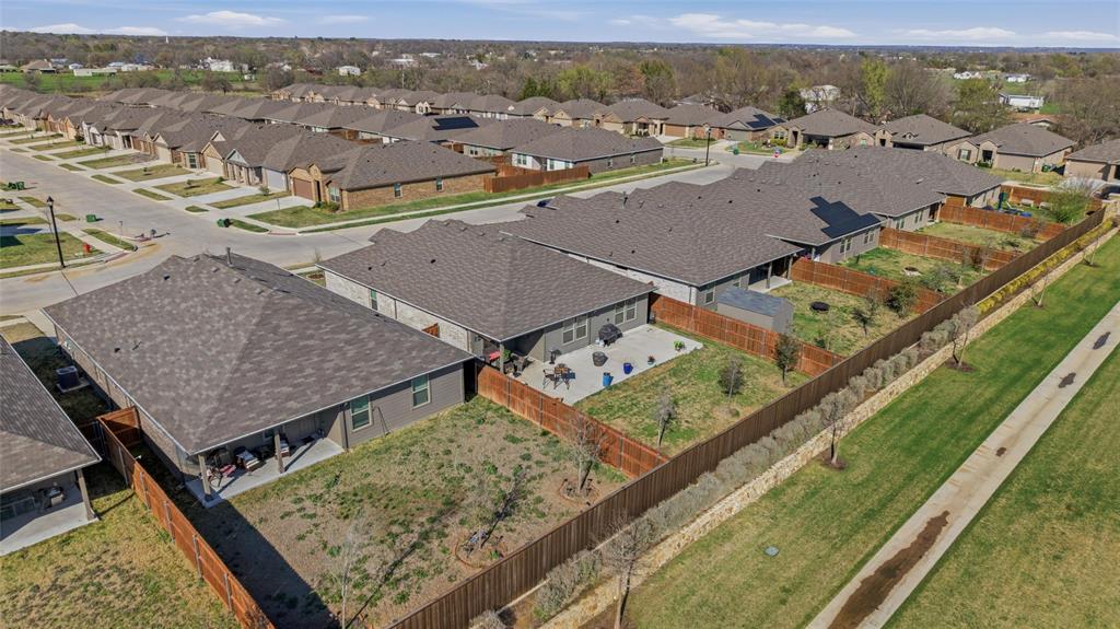 316 Sculptors Crossing Springtown, TX 76082 - Photo 17 of 19 an aerial view of residential houses with outdoor space and city view