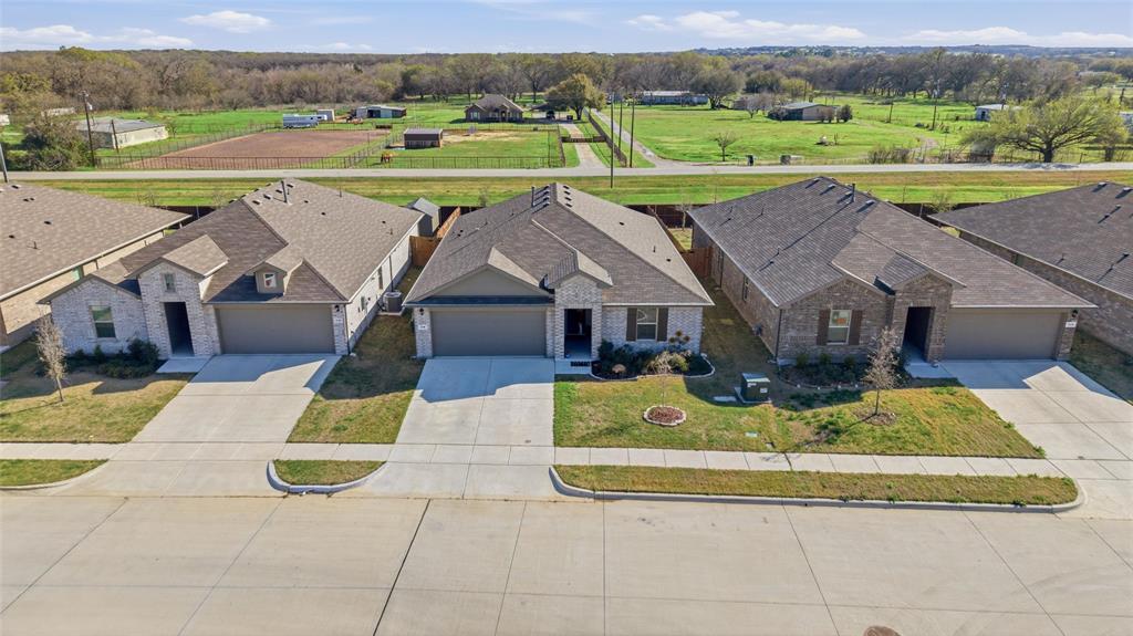 316 Sculptors Crossing Springtown, TX 76082 - Photo 2 of 19 an aerial view of a house with big yard