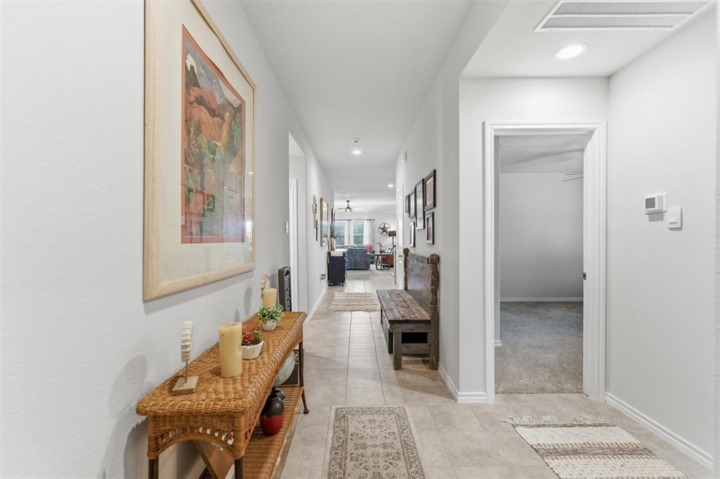 316 Sculptors Crossing Springtown, TX 76082 - Photo 3 of 19 a living room with furniture and a potted plant