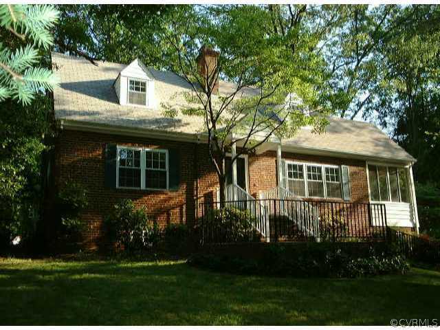 7731 Brookside Road Richmond, VA 23229 - Photo 1 of 7 a front view of a house with a yard and trees