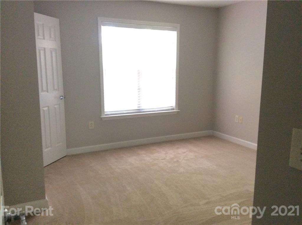 6614 Bevington Ridge Road, Unit B Charlotte, NC 28277 - Photo 11 of 16 an empty room with a window