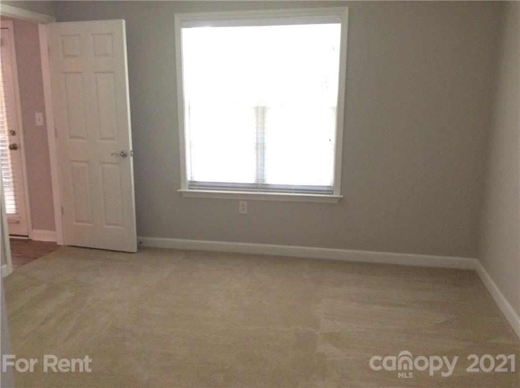 6614 Bevington Ridge Road, Unit B Charlotte, NC 28277 - Photo 12 of 16 an empty room with a window