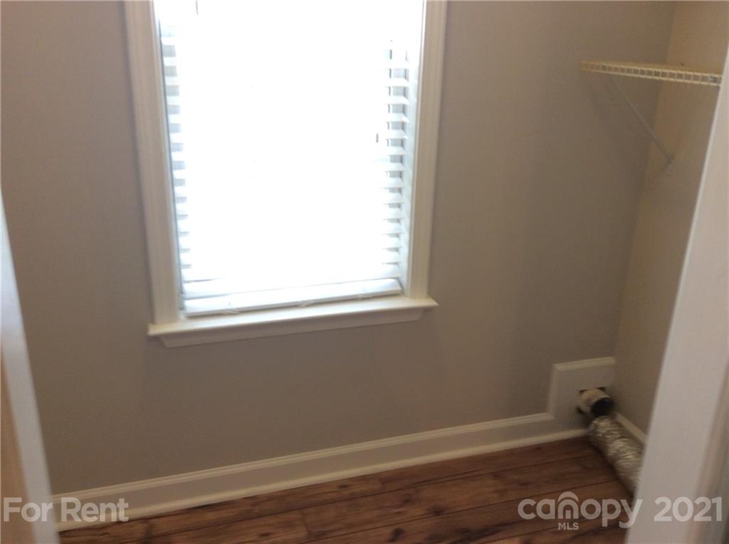 6614 Bevington Ridge Road, Unit B Charlotte, NC 28277 - Photo 15 of 16 a view of a small space with wooden floor and a window