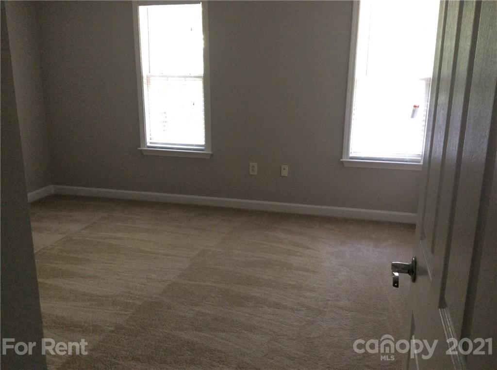 6614 Bevington Ridge Road, Unit B Charlotte, NC 28277 - Photo 16 of 16 a view of an empty room with a window
