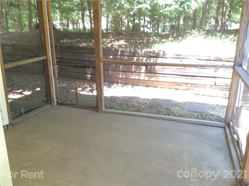 6614 Bevington Ridge Road, Unit B Charlotte, NC 28277 - Photo 5 of 16 a view of a glass door and a yard