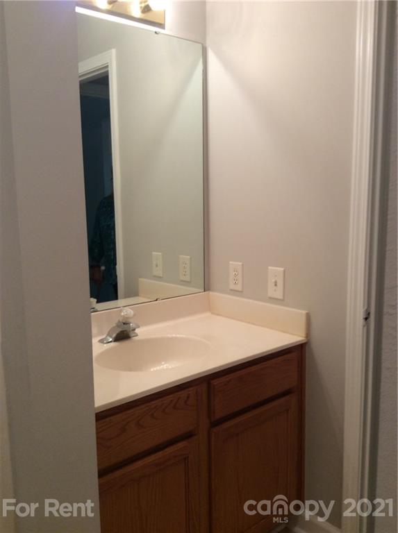 6614 Bevington Ridge Road, Unit B Charlotte, NC 28277 - Photo 9 of 16 a bathroom with a sink and a mirror