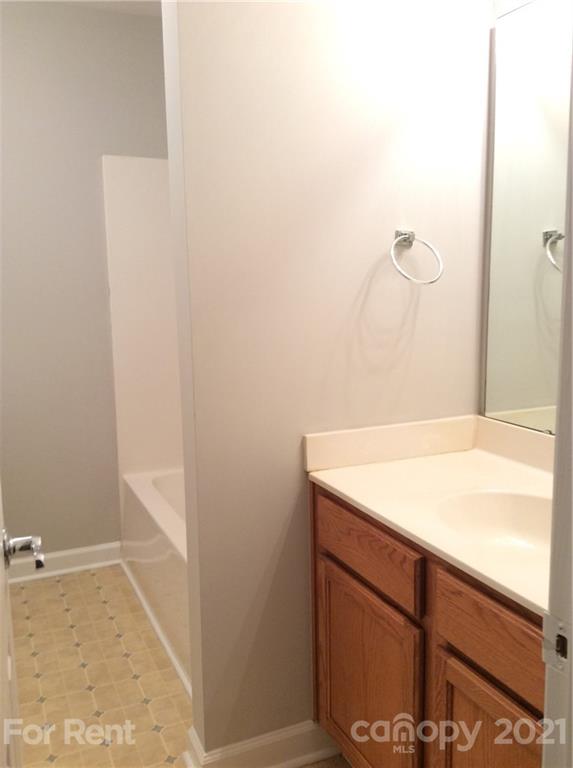 6614 Bevington Ridge Road, Unit B Charlotte, NC 28277 - Photo 10 of 16 a bathroom with a sink and a mirror