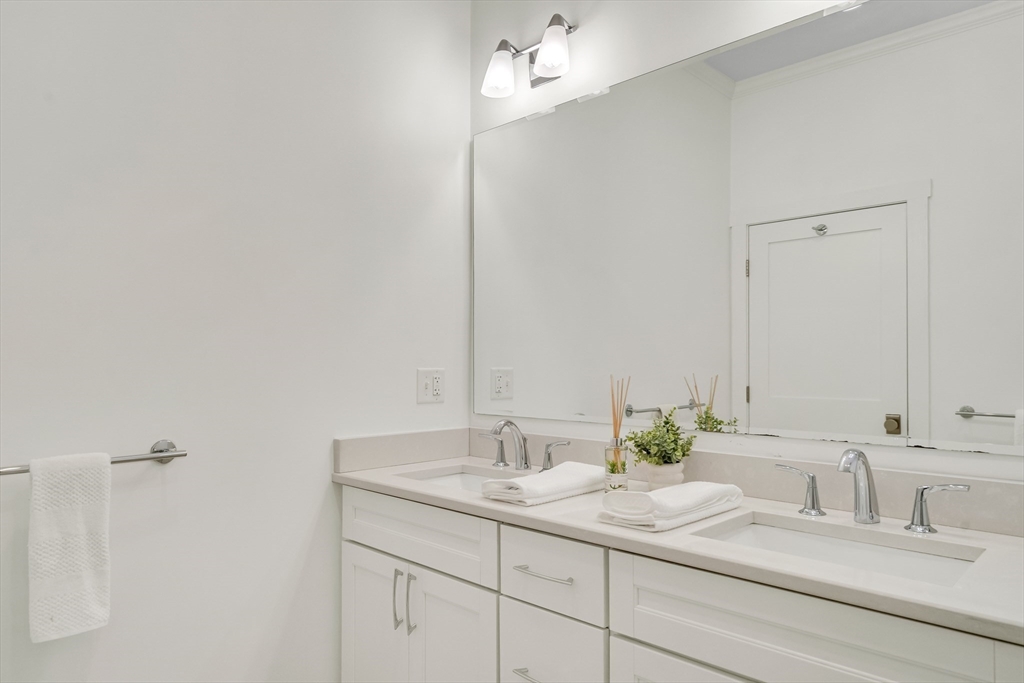20 Lila Road Boston, MA 02130 - Photo 15 of 28 a bathroom with a double vanity sink and a mirror