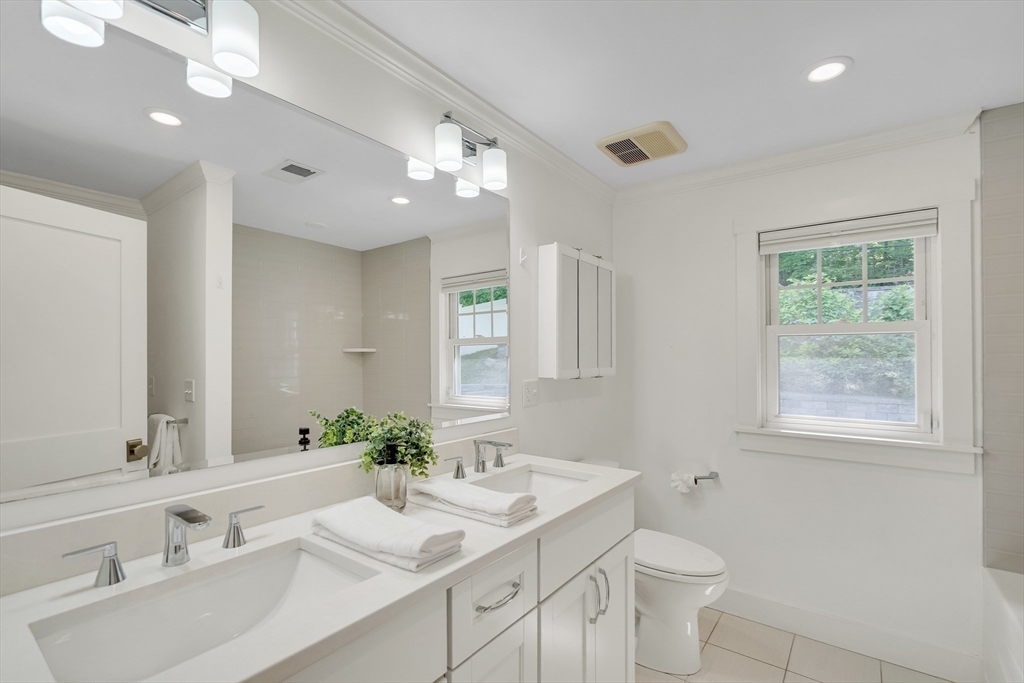 20 Lila Road Boston, MA 02130 - Photo 23 of 28 a bathroom with a sink double vanity and a mirror