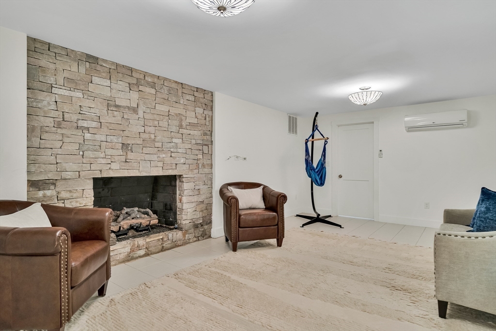 20 Lila Road Boston, MA 02130 - Photo 26 of 28 a living room with furniture and a fireplace