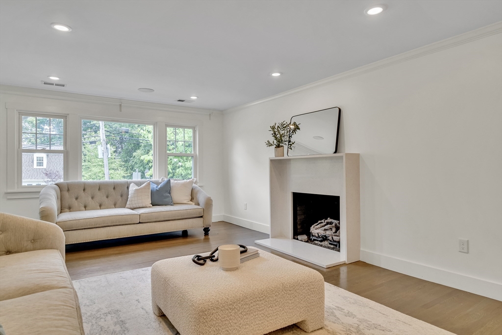 20 Lila Road Boston, MA 02130 - Photo 4 of 28 a living room with furniture and a fireplace