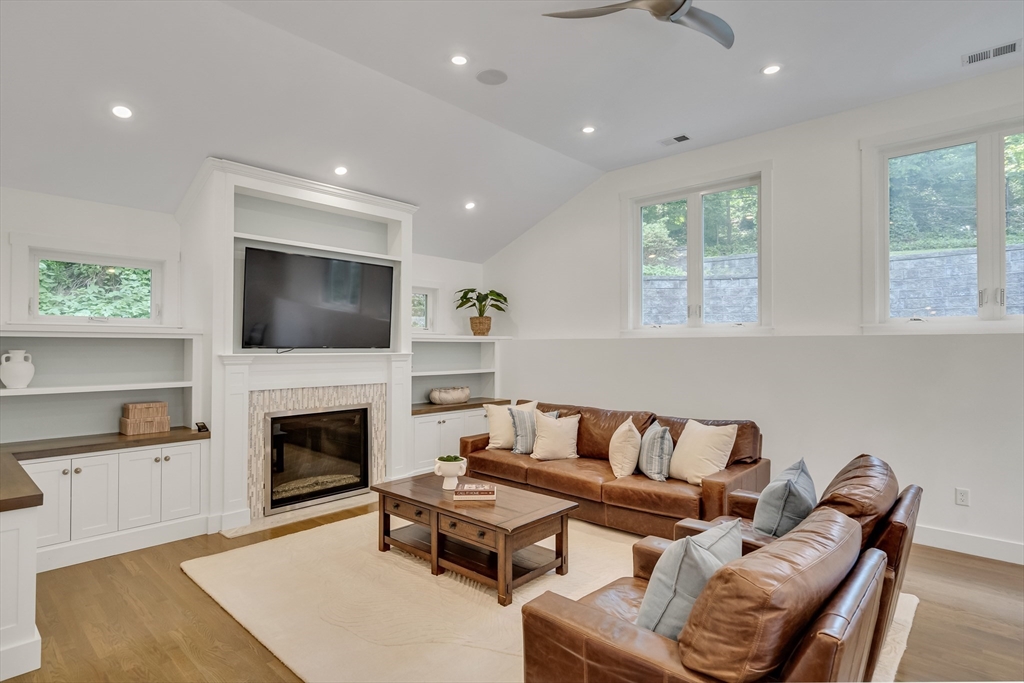 20 Lila Road Boston, MA 02130 - Photo 5 of 28 a living room with furniture and a fireplace
