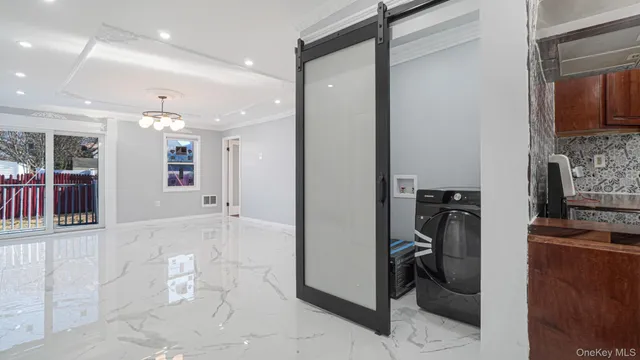 a kitchen with stainless steel appliances granite countertop a stove a refrigerator and a sink