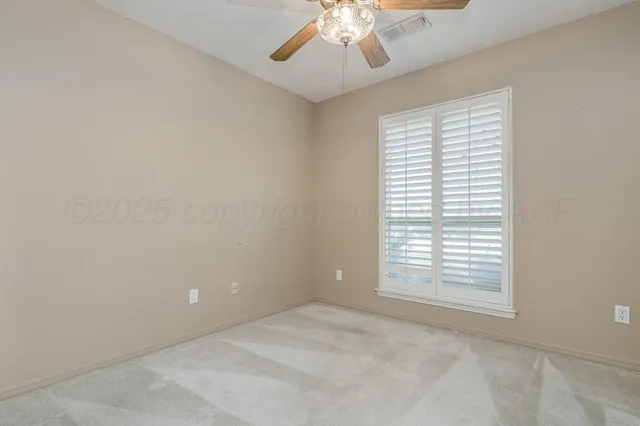 a view of an empty room and window