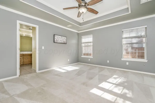 a spacious bathroom with a tub sink shower and mirror