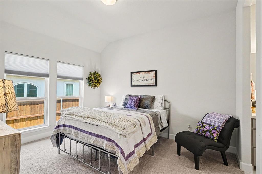 573 Broadleaf Way Haslet, TX 76052 - Photo 27 of 35 a bedroom with a bed and a window