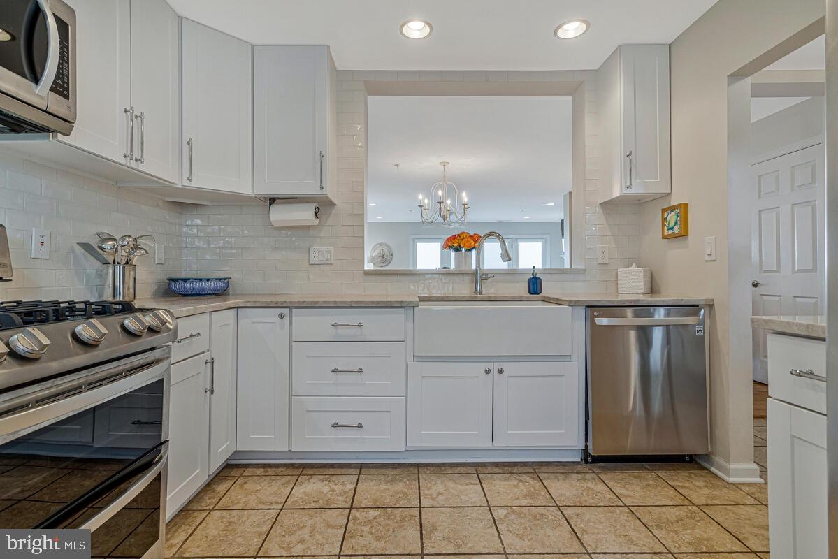 8605 Addison Bridge Place Chesapeake Beach, MD 20732 - Photo 9 of 63 Gourmet Kitchen with Gas Stove, SS and Quartzite