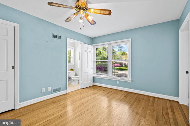 a kitchen with stainless steel appliances granite countertop a sink and a refrigerator