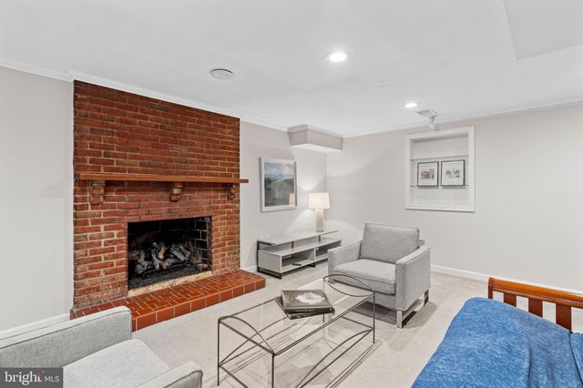 a dining room with furniture and a rug