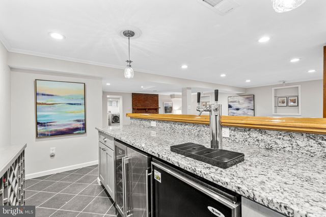 a view of a swimming pool with a yard and seating area