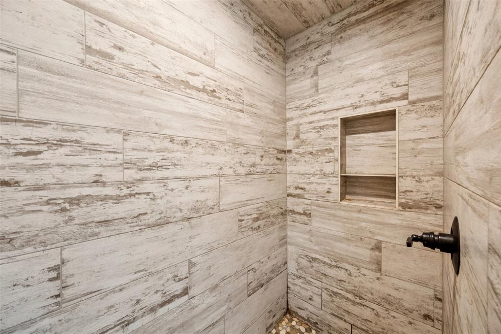 709 Coblestone Circle Mabank, TX 75147 - Photo 15 of 24 a bathroom with a shower