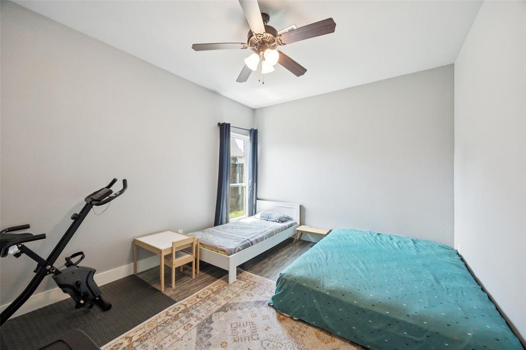 709 Coblestone Circle Mabank, TX 75147 - Photo 16 of 24 a bedroom with furniture and a window