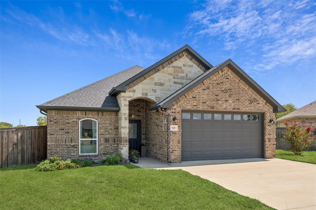 709 Coblestone Circle Mabank, TX 75147 - Photo 2 of 24 a view of front of a house with a yard