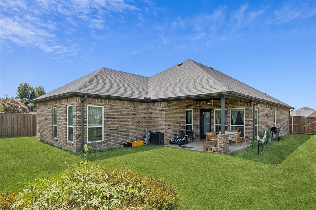 709 Coblestone Circle Mabank, TX 75147 - Photo 23 of 24 a view of a house with backyard porch and garden