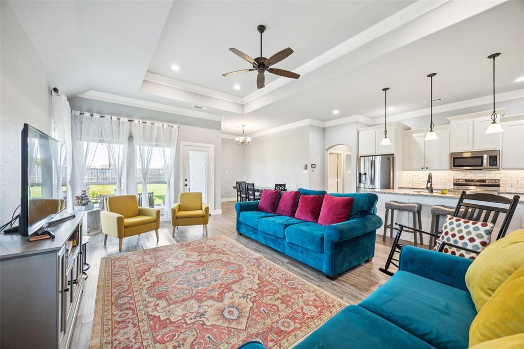 709 Coblestone Circle Mabank, TX 75147 - Photo 4 of 24 a living room with furniture kitchen view and a large window