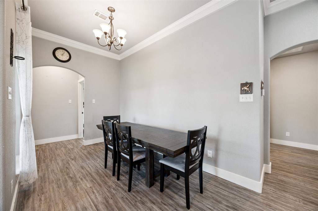 709 Coblestone Circle Mabank, TX 75147 - Photo 9 of 24 a view of a dining room with furniture and wooden floor