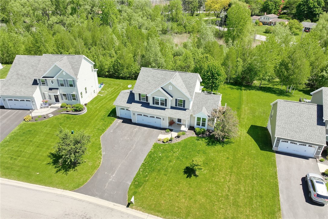 32 Ashlyn Rise Penfield, NY 14450 - Photo 2 of 50 Aerial view of the home showing green space behind