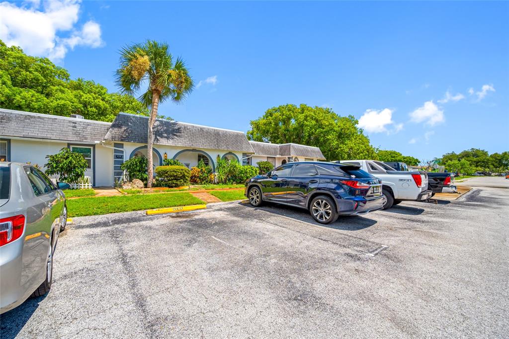 a view of a cars parked in front of a house