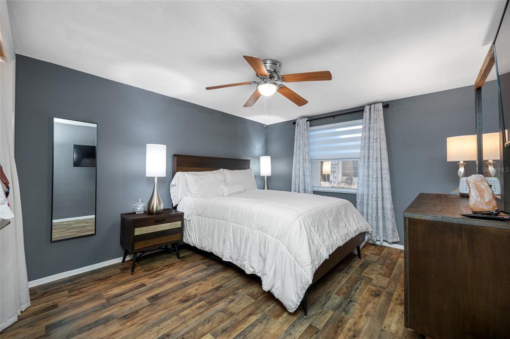 4210 Touchton Place, Unit 2 New Port Richey, FL 34652 - Photo 19 of 34 a bedroom with a bed desk and a window