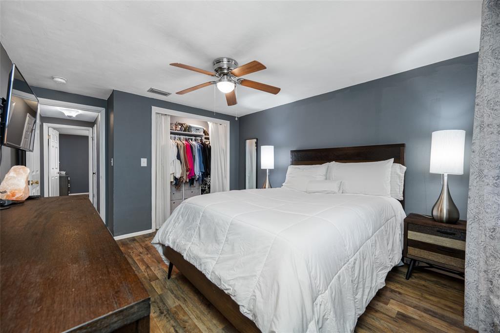 4210 Touchton Place, Unit 2 New Port Richey, FL 34652 - Photo 21 of 34 a bedroom with bed and wooden floor