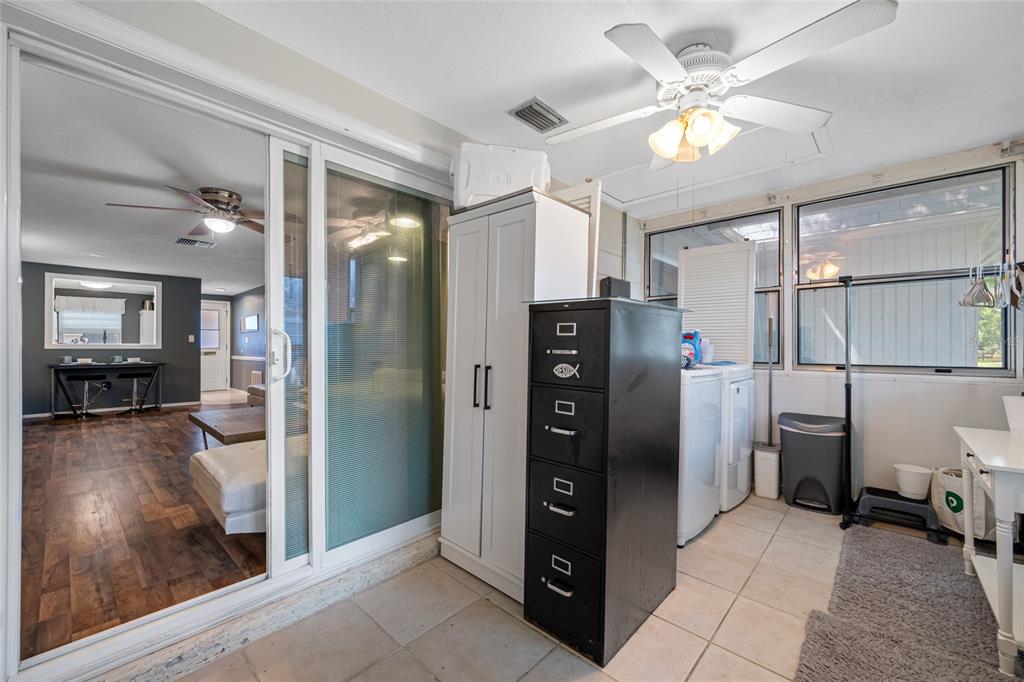 4210 Touchton Place, Unit 2 New Port Richey, FL 34652 - Photo 29 of 34 a view of a kitchen with refrigerator and wooden floor