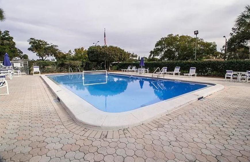 4210 Touchton Place, Unit 2 New Port Richey, FL 34652 - Photo 33 of 34 a view of a swimming pool with a chair