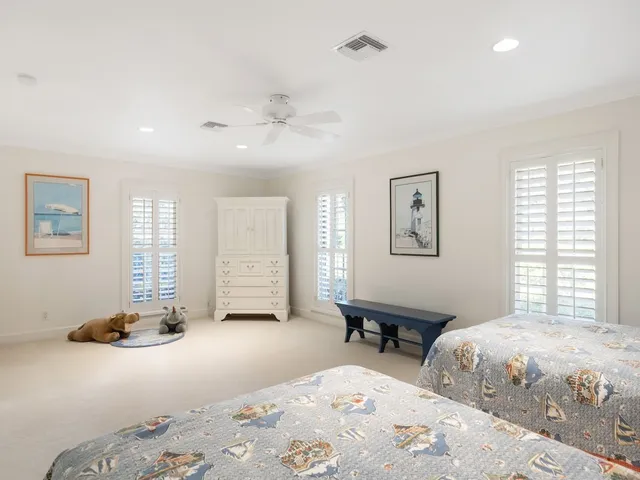 a bedroom with furniture and a window