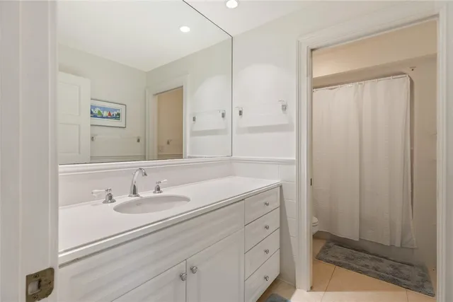 a bathroom with a sink a vanity and a mirror