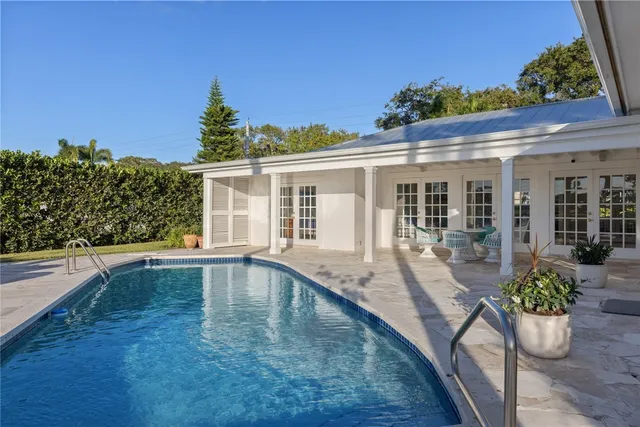 swimming pool view with outdoor seating