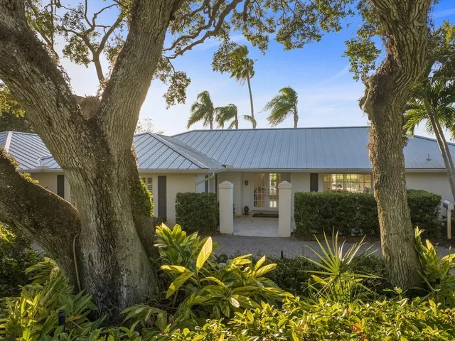 a view of a potted plants in front of a house