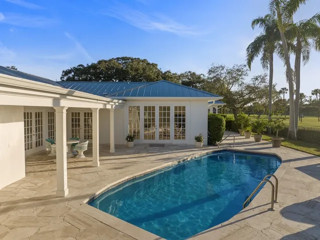 front view of a house with a swimming pool